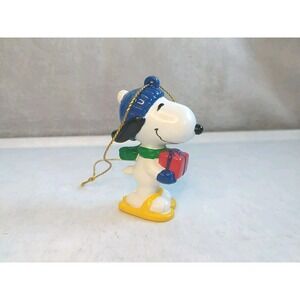 Snoopy wearing‎ Snowshoesand holding Gift Peanuts PVC Ornament